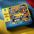 The Beatles Yellow Submarine puzzle box on a blue and yellow surface