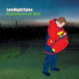 This image features the cover of the album "Nightmares On Wax - Late Night Tales 2LP." The cover depicts a silhouette of a person in a red and blue jacket, standing near a tree and looking off to the distance, under a night sky.