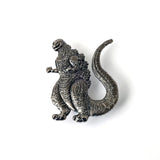 Metallic Godzilla figurine on a white background