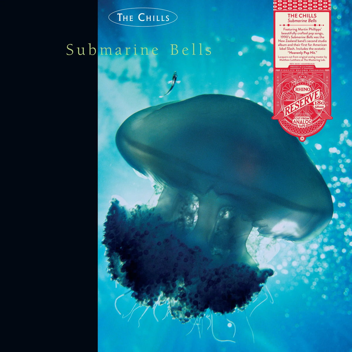 Album cover for 'Submarine Bells' by The Chills, featuring a large translucent jellyfish in blue ocean water with a black vertical band on the left and a red circular 'Rescue' sticker graphic on the top right.
