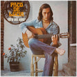 Album cover featuring a person playing guitar with text 'Paco de Lucia' and 'Entre Dos Aguas'.