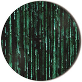 Vinyl record with Matrix-style green code text on a black background