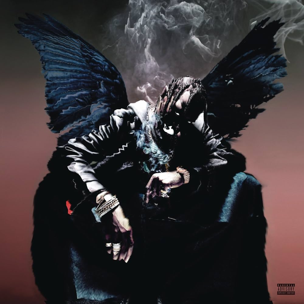 Person with butterfly wings and dark clothing against a smoky background