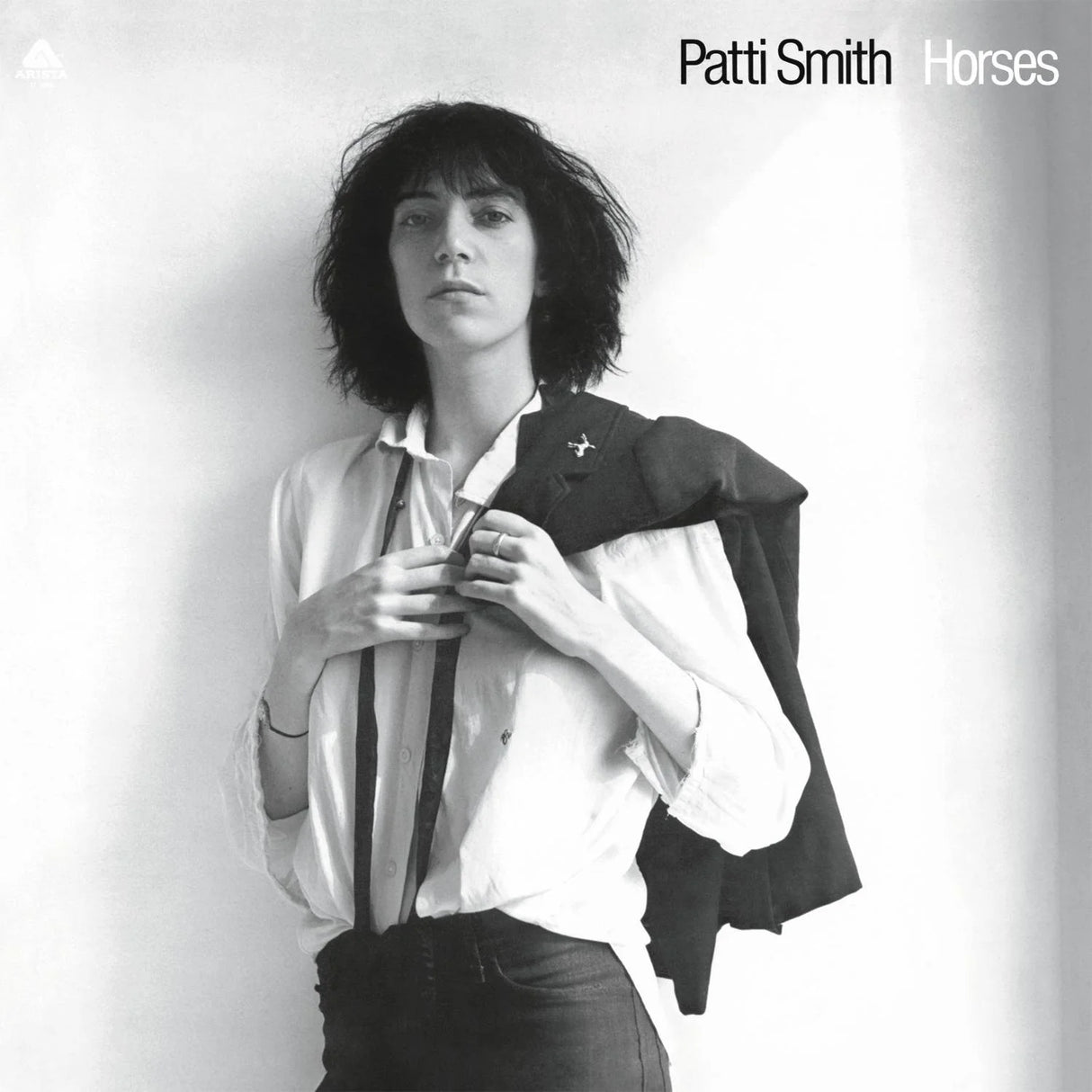 Black and white album cover featuring a person with text 'Patti Smith Horses'.