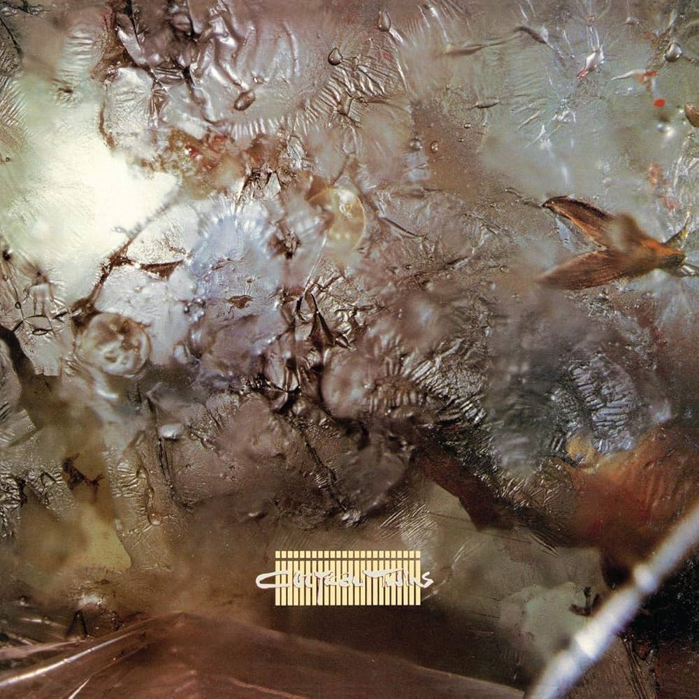 Close-up of a textured surface with a brand logo at the bottom.