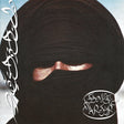 Person wearing a black niqab with Arabic text on a light background