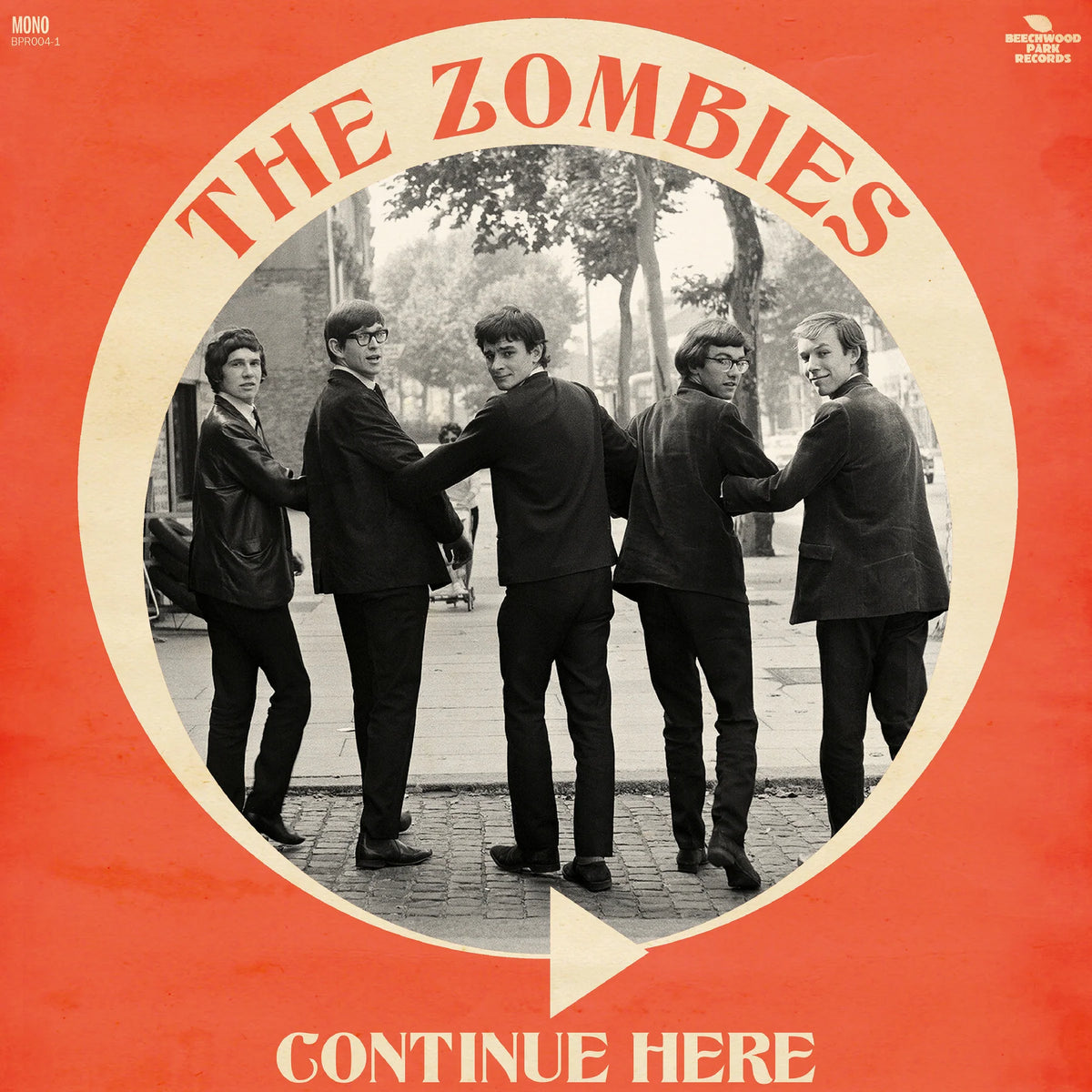 The Zombies 'Continue Here' vinyl record cover, featuring a vintage black-and-white photo of the band in suits inside a cream circle on a bright red background.