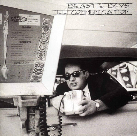 Album cover with a person holding a cup, menu, and 'Beastie Boys Ill Communication' text.