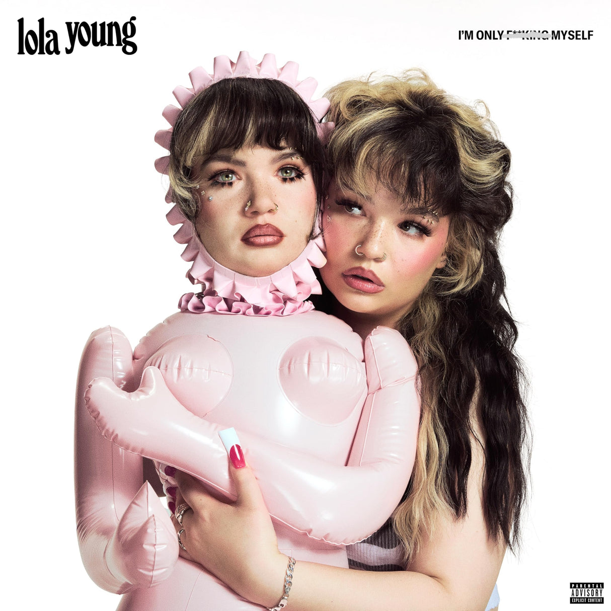 Two women with styled hair holding a pink balloon, with 'lola young' branding.
