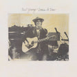 Album cover with a person holding a guitar, featuring text 'Neil Young - Comes A Time'.