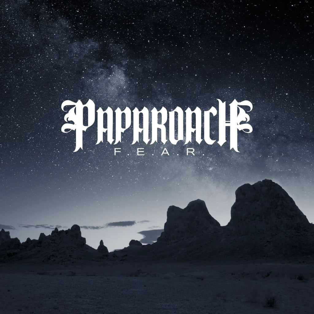 Album cover with 'Paparozzi F.E.A.R.' text over a desert landscape at night.