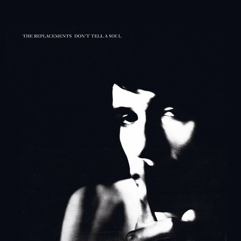 Album cover with a black and white silhouette of a person against a dark background, featuring text at the top.