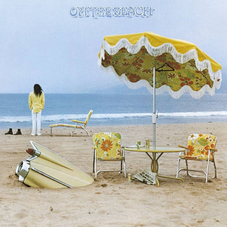 Album cover with a person on a beach, table, chairs, and umbrella with 'Out the Beach' text.