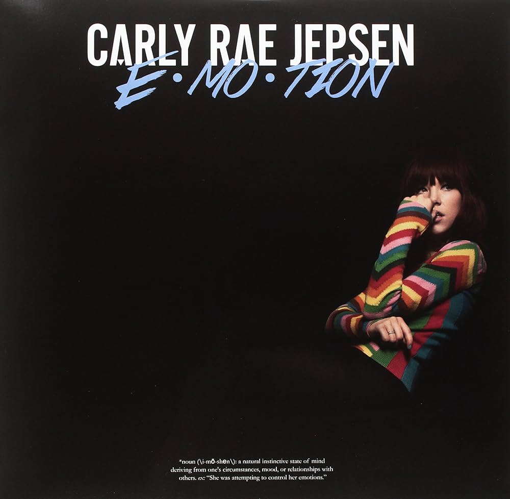 Album cover for 'Emotion' by Carly Rae Jepsen with a person in a colorful sweater.