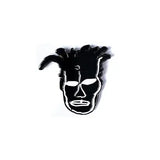 Black and white mask-like pin on a white background