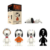 Peanuts-themed action figures with packaging on a white background