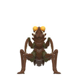 Toy figure of a praying mantis with large eyes on a white background