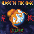 Lip balm packaging with a dragon design and text 'Close to the Edge' on a starry background.