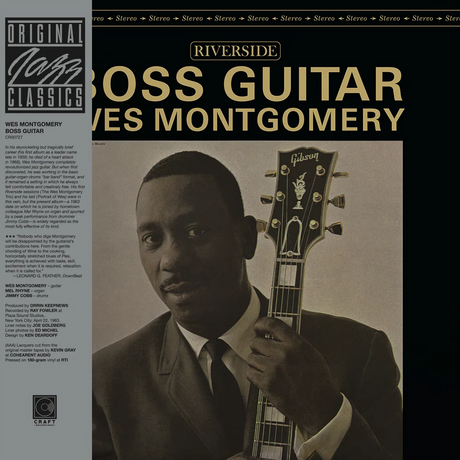 Album cover featuring a man holding a guitar with text about 'Boss Guitar' by Wes Montgomery.