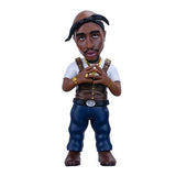Bobblehead figure of a person wearing a leather jacket and blue pants on a white background
