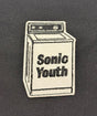 Embroidered patch of a washing machine with 'Sonic Youth' text on a dark background