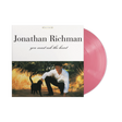 Vinyl record with a cover featuring a man and a dog in a field, labeled 'Jonathan Richman you must ask the heart'.