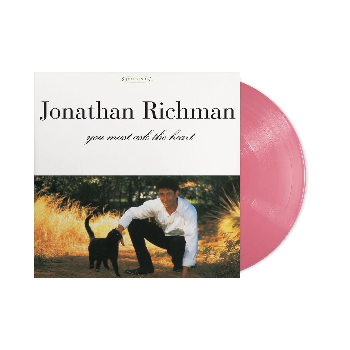 Vinyl record with a cover featuring a man and a dog in a field, labeled 'Jonathan Richman you must ask the heart'.