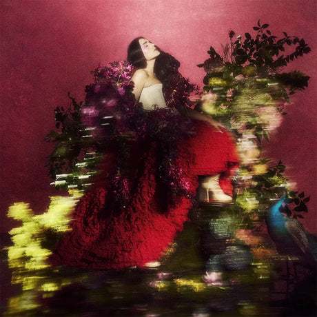 Woman in a red dress surrounded by flowers against a pink background