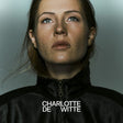 Woman wearing a dark jacket with 'Charlotte de Witte' text overlay