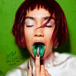 Woman with green lipstick and red hair against a green background