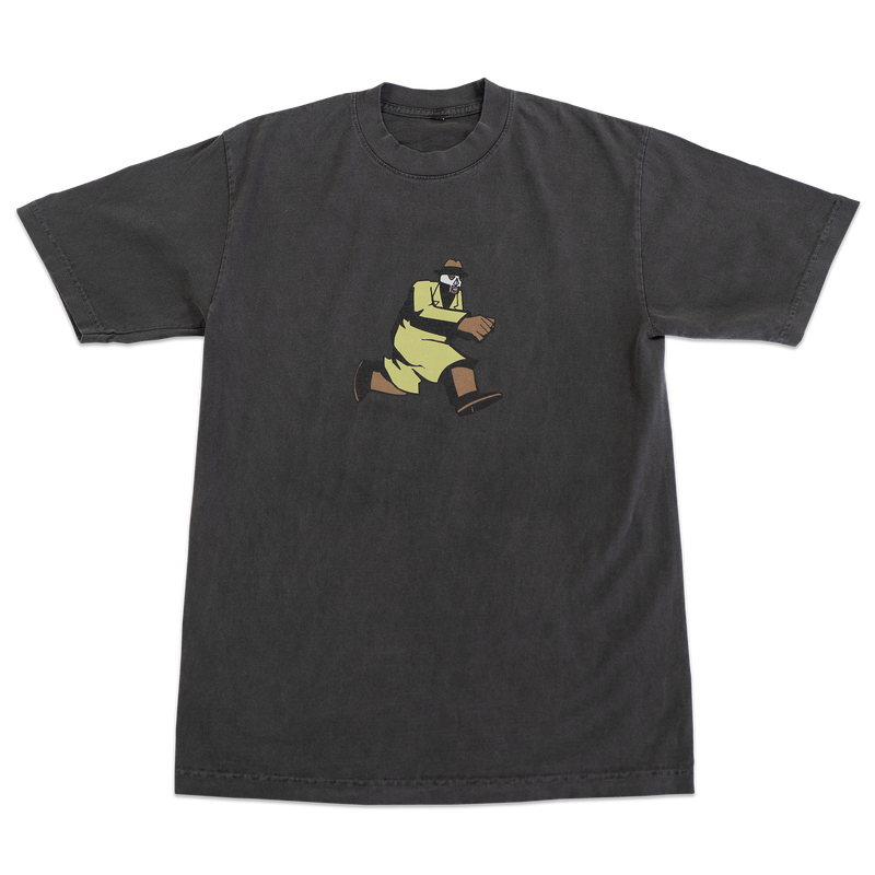 Black t-shirt with a graphic of a person in yellow pants and brown shoes on a white background