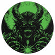 Circular design with a demon-like creature in black on a green background