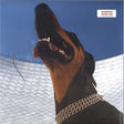 A vinyl record titled 'Overmono - Good Lies LP' featuring a close-up photograph of a dog's face, specifically a Doberman Pinscher, with a blue sky in the background.