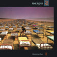 Album cover with a person sitting on a bed in an orderly arrangement of beds on a beach, featuring the Pink Floyd logo.
