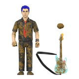 A collectible action figure of a man with blue hair wearing a brown and black splattered shirt and pants with a red tie, shown alongside a matching rusted electric guitar and a floating rock accessory on a white background.