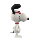 Snoopy figurine with red collar and sunglasses on a white background