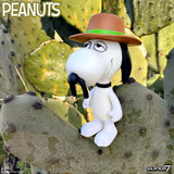 Snoopy figurine with a hat on a cactus plant, with 'Peanuts' branding.