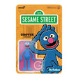 Sesame Street Grover action figure packaging with Sesame Street sign in the background