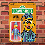 Sesame Street Bert action figure packaging on a brick background