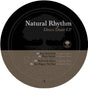 A circular album cover for 'Natural Rhythm Disco Daze EP' by Roots, featuring a black upper half with a tree silhouette and white text, and a brown lower half with tracklist text.