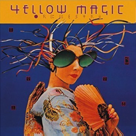 Album cover for Yellow Magic Orchestra featuring a stylized illustration of a woman with a fan and sunglasses, set against a blue background with floral motifs.