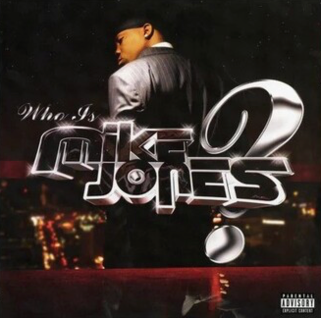 Album cover with text 'Who Is Mike Jones?' against a cityscape background
