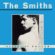 Album cover for 'The Smiths' with a blue background and black and white photo of a person.