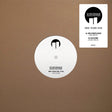 Vinyl record with white label on brown background, featuring Suburban Architectures logo and track information.