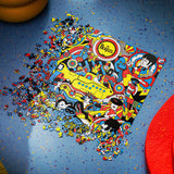 Puzzle of The Beatles album cover with pieces scattered on a blue background