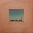 Album cover with a silhouette of cows and a pole on a textured background, featuring the text 'Khruangbin' and 'Con Todo El Mundo'.