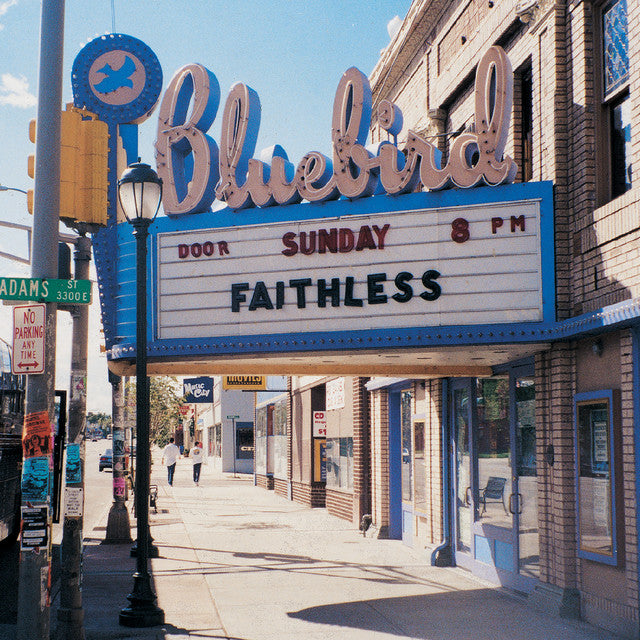 The Bluebird Theater marquee with 'Faithless' performance information on a sunny day.