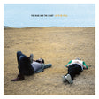 Album cover with two people lying on a grassy field and 'The Head and The Heart' text.