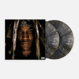 Vinyl record with a cover featuring a person wearing a headwrap on a white background