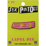 A 'Sex Pistols' lapel pin displayed on its original lime green backing card. The pin features the band's name in yellow with a dripping black outline on a pink background.